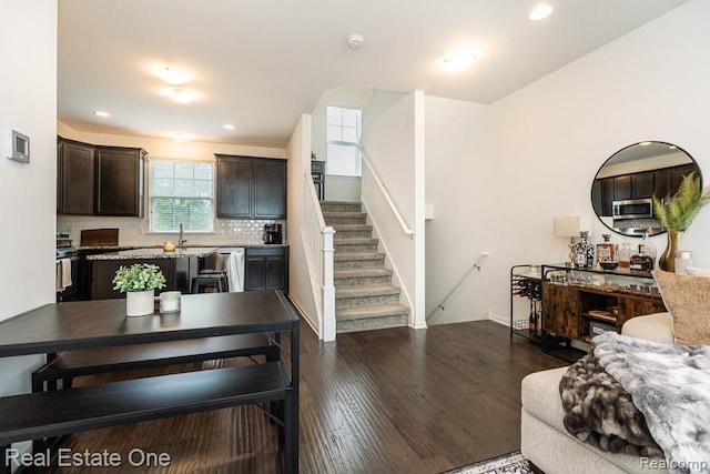4661 Bradley Cir, Troy, MI 48085 - dining area with dark wood finished floors, stairway, baseboards, and recessed lighting