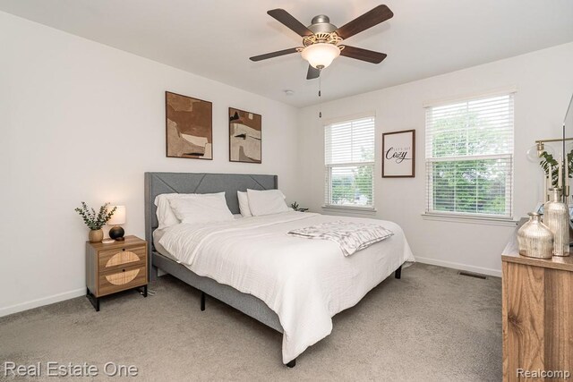 4661 Bradley Cir, Troy, MI 48085 - bedroom featuring baseboards, light colored carpet, and ceiling fan