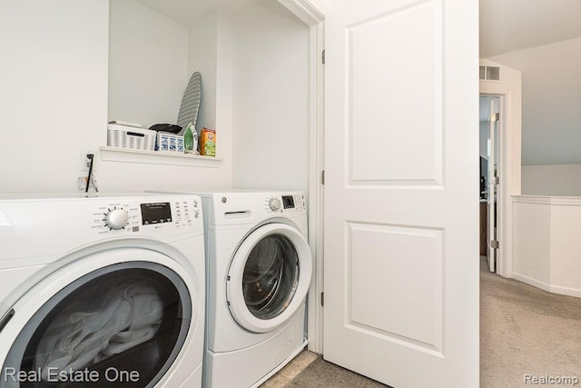 4661 Bradley Cir, Troy, MI 48085 - laundry room with washing machine and clothes dryer and light colored carpet