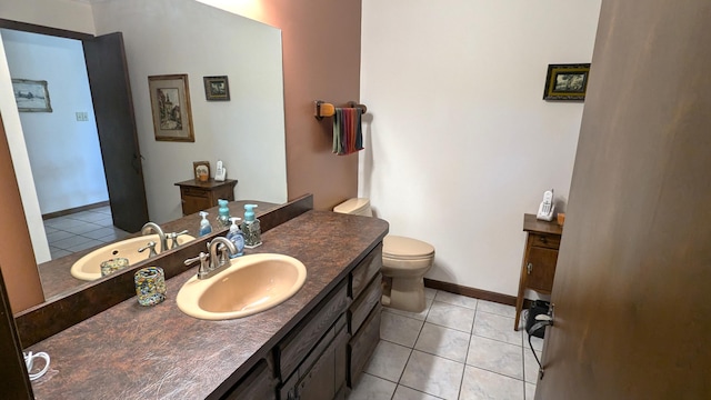 66109 Hideaway Ln, Sturgis, MI 49091 - bathroom with tile patterned flooring, vanity, toilet, and baseboards