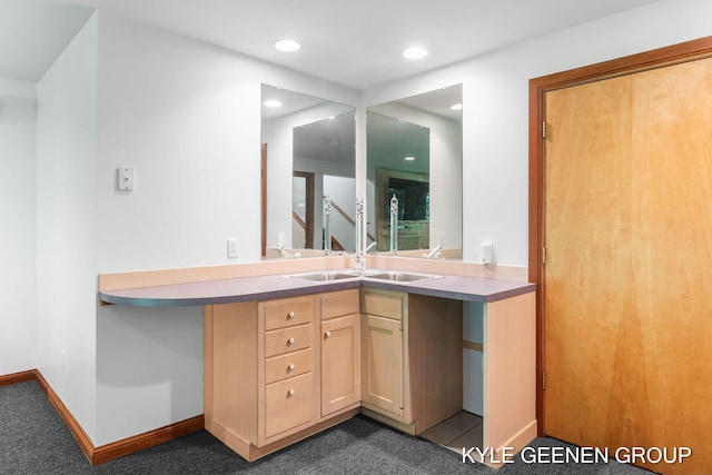 2229 Brighton St, Holland, MI 49424 - bathroom with recessed lighting, vanity, and baseboards