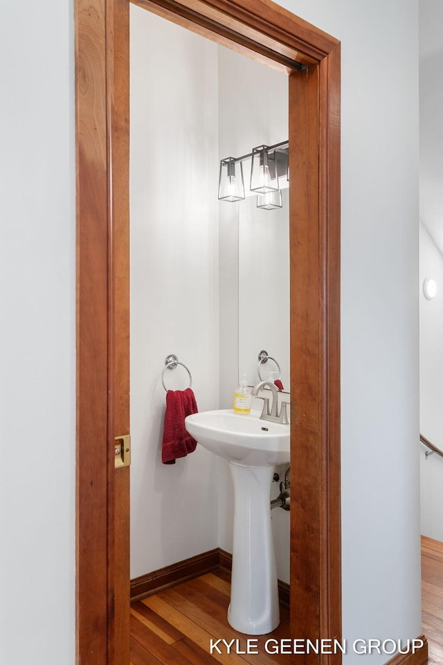 2229 Brighton St, Holland, MI 49424 - half bath featuring wood finished floors and baseboards
