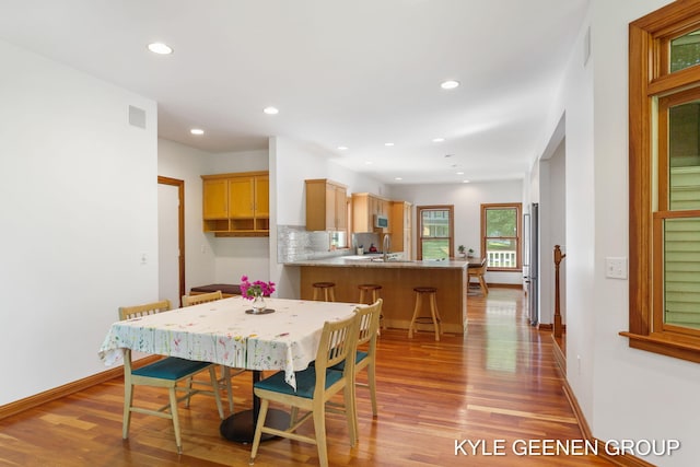 2229 Brighton St, Holland, MI 49424 - dining space featuring light wood finished floors, recessed lighting, and baseboards
