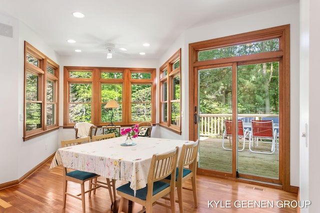 2229 Brighton St, Holland, MI 49424 - dining area with baseboards, a ceiling fan, recessed lighting, and light wood-type flooring