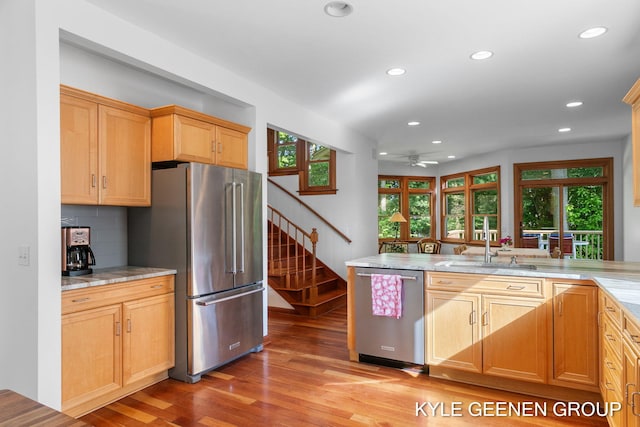 2229 Brighton St, Holland, MI 49424 - kitchen with appliances with stainless steel finishes, recessed lighting, light wood finished floors, healthy amount of natural light, and a ceiling fan