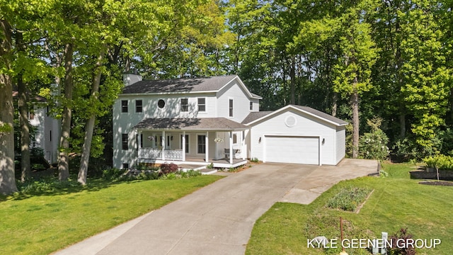 2229 Brighton St, Holland, MI 49424 - view of front of home featuring covered porch, a garage, driveway, and a front yard