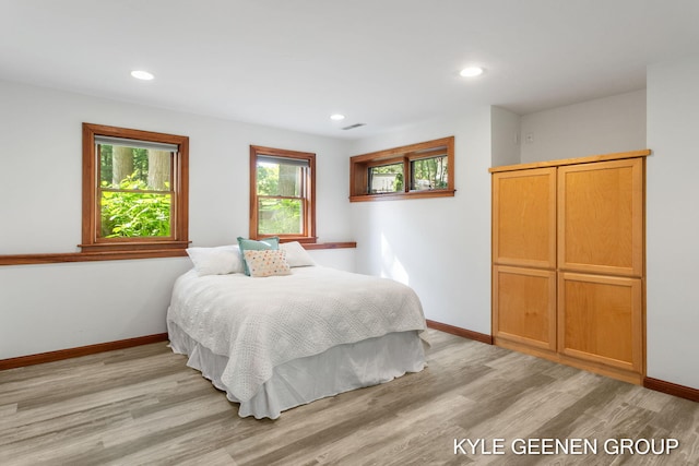 2229 Brighton St, Holland, MI 49424 - bedroom featuring light wood-style flooring, baseboards, and recessed lighting