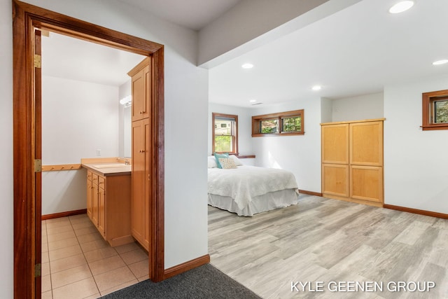 2229 Brighton St, Holland, MI 49424 - bedroom with a sink, baseboards, recessed lighting, and light wood-style floors