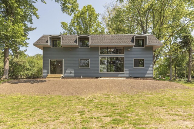 2971 Daleview Dr, Ann Arbor, MI 48105 - back of property featuring a lawn and roof with shingles