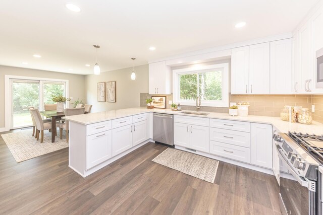 2971 Daleview Dr, Ann Arbor, MI 48105 - kitchen featuring appliances with stainless steel finishes, a sink, healthy amount of natural light, white cabinetry, and recessed lighting
