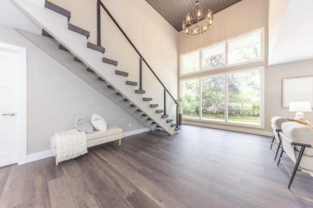 2971 Daleview Dr, Ann Arbor, MI 48105 - entryway featuring high vaulted ceiling, a chandelier, stairs, wood finished floors, and baseboards