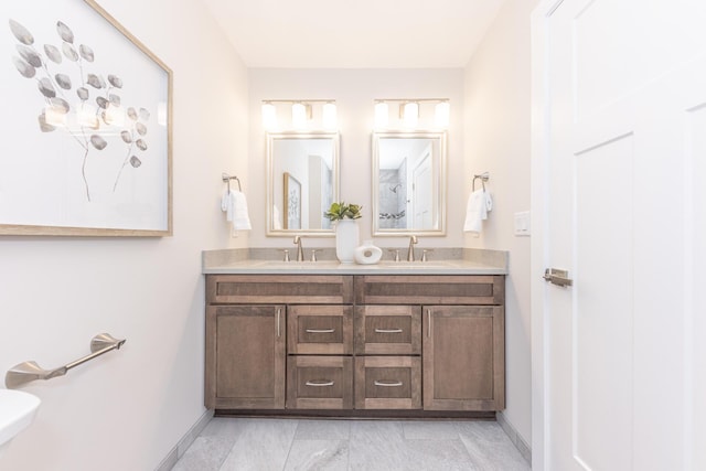 2971 Daleview Dr, Ann Arbor, MI 48105 - bathroom with baseboards, double vanity, and toilet