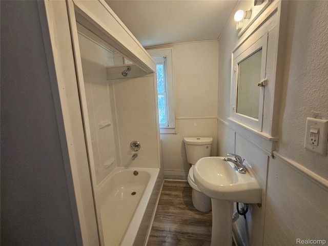 48 W Charlotte St, Ecorse, MI 48229 - bathroom featuring wood finished floors, toilet, a textured wall, and tub / shower combination