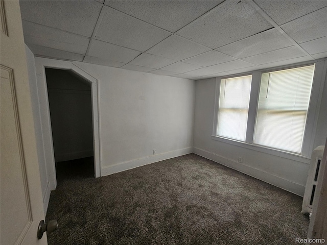 48 W Charlotte St, Ecorse, MI 48229 - unfurnished room featuring carpet floors, a drop ceiling, and baseboards