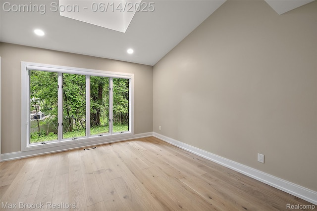 3546 Bloomfield Club Dr, Bloomfield Hills, MI 48301 - spare room with baseboards, wood finished floors, a skylight, and recessed lighting