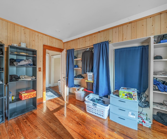 405 E Saginaw St, Saint Louis, MI 48880 - bedroom with wood walls and wood finished floors