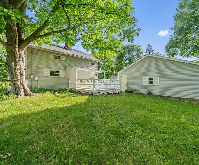 405 E Saginaw St, Saint Louis, MI 48880 - view of grassy yard with a wooden deck