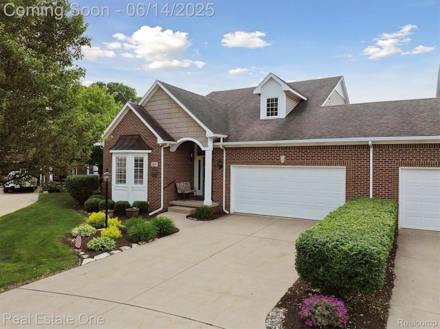 446 Delmar Ct, Highland, MI 48357 - view of front facade with brick siding, driveway, a garage, and roof with shingles