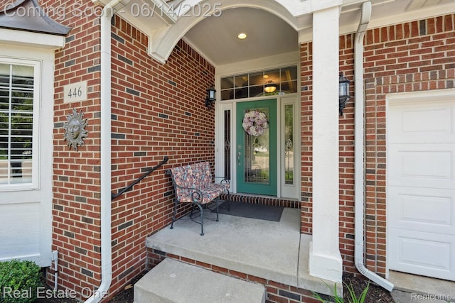 446 Delmar Ct, Highland, MI 48357 - entrance to property featuring brick siding and a porch