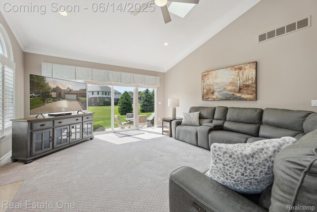 446 Delmar Ct, Highland, MI 48357 - living area with carpet, a ceiling fan, vaulted ceiling, ornamental molding, and baseboards