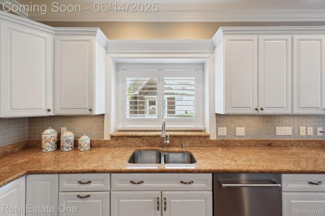 446 Delmar Ct, Highland, MI 48357 - kitchen featuring a sink, white cabinetry, dishwasher, backsplash, and light countertops