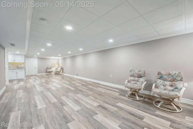 446 Delmar Ct, Highland, MI 48357 - living area with recessed lighting, light wood finished floors, baseboards, and a drop ceiling