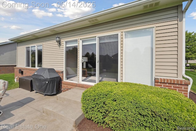 446 Delmar Ct, Highland, MI 48357 - rear view of property featuring brick siding