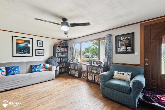 7131 Houghton Dr, Davison, MI 48423 - living area with hardwood / wood-style floors, a ceiling fan, crown molding, and a textured ceiling