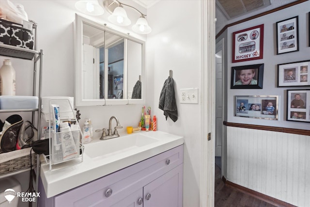 7131 Houghton Dr, Davison, MI 48423 - bathroom with wood finished floors, vanity, and baseboards