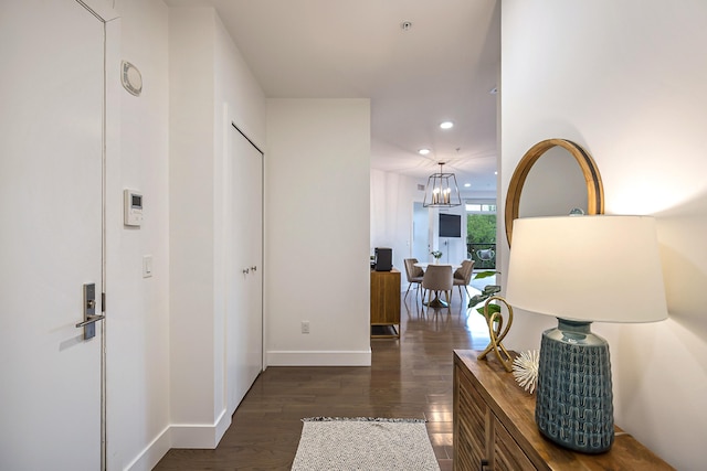 218 W Kingsley St Unit 507, Ann Arbor, MI 48103 - hall featuring recessed lighting, dark wood-style floors, a chandelier, and baseboards