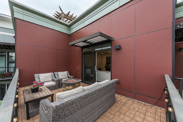 218 W Kingsley St Unit 507, Ann Arbor, MI 48103 - view of patio featuring an outdoor living space with a fire pit