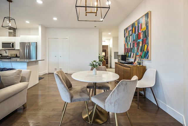 218 W Kingsley St Unit 507, Ann Arbor, MI 48103 - dining area featuring baseboards, recessed lighting, a chandelier, and dark wood-type flooring
