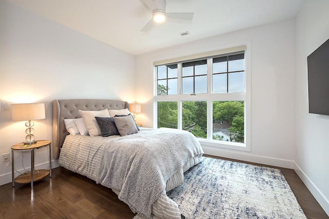 218 W Kingsley St Unit 507, Ann Arbor, MI 48103 - bedroom with baseboards, dark wood-style floors, and ceiling fan
