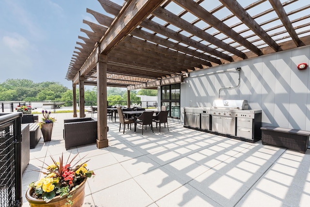 218 W Kingsley St Unit 507, Ann Arbor, MI 48103 - view of patio with outdoor dining area, a pergola, and an outdoor kitchen