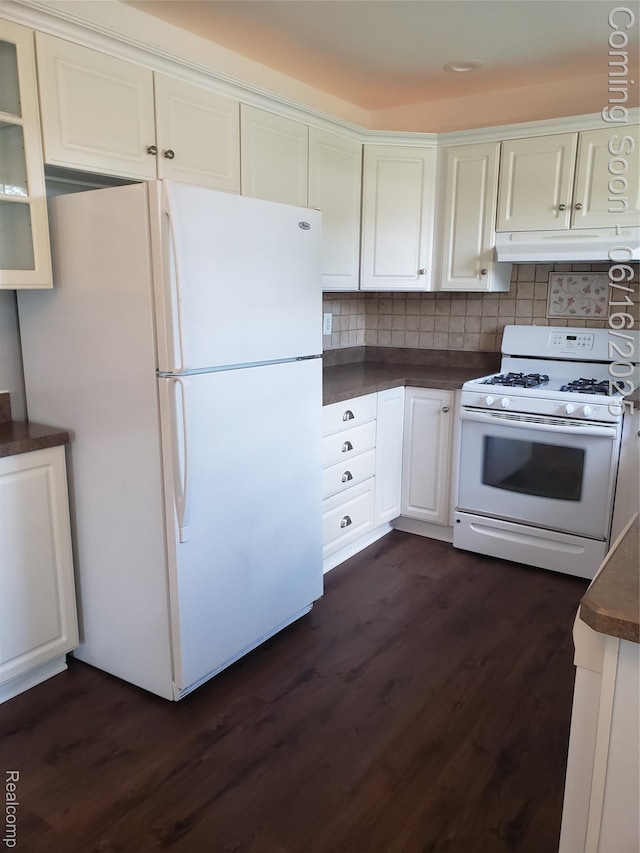 8224 Milburn St, Westland, MI 48185 - kitchen with white appliances, under cabinet range hood, dark countertops, and dark wood-style flooring