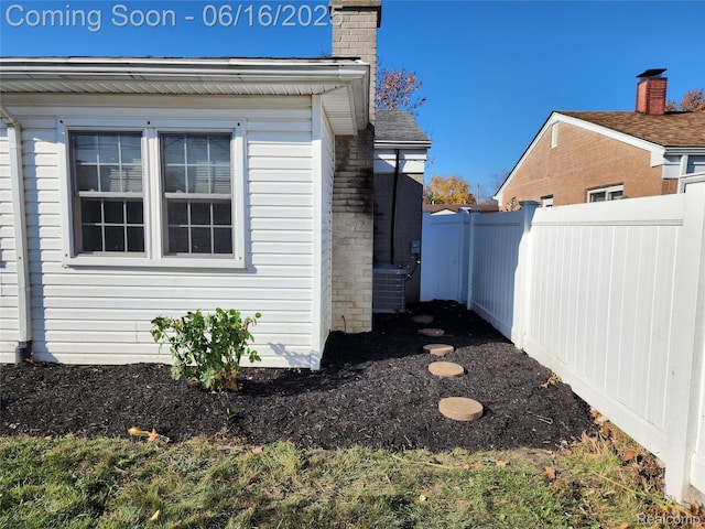 8224 Milburn St, Westland, MI 48185 - view of home's exterior with a chimney