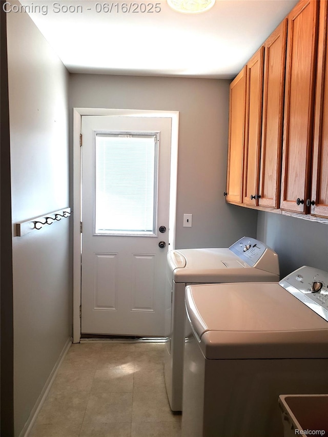 8224 Milburn St, Westland, MI 48185 - laundry area featuring washing machine and dryer, cabinet space, and light tile patterned floors