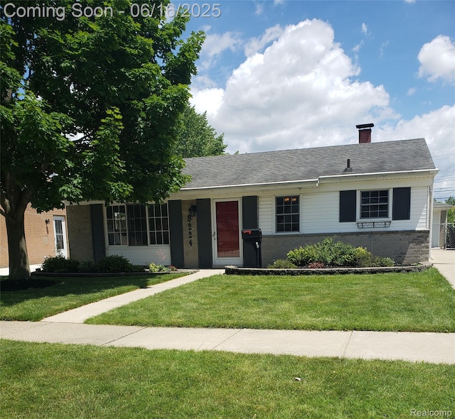 8224 Milburn St, Westland, MI 48185 - ranch-style home with a front yard and a chimney
