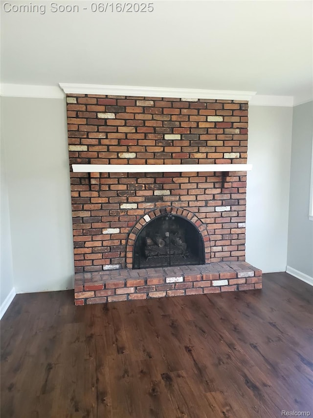 8224 Milburn St, Westland, MI 48185 - detailed view of a brick fireplace, wood finished floors, and crown molding