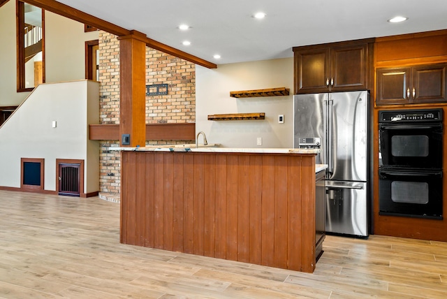 4693 Gallagher Rd, Rochester, MI 48306 - kitchen featuring stainless steel fridge with ice dispenser, open shelves, light wood finished floors, recessed lighting, and light countertops