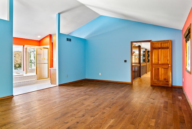 4693 Gallagher Rd, Rochester, MI 48306 - unfurnished living room with hardwood / wood-style flooring, vaulted ceiling, and baseboards