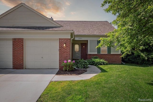 43687 Christopher Ct, Canton, MI 48188 - view of front of home with brick siding, roof with shingles, driveway, and a lawn
