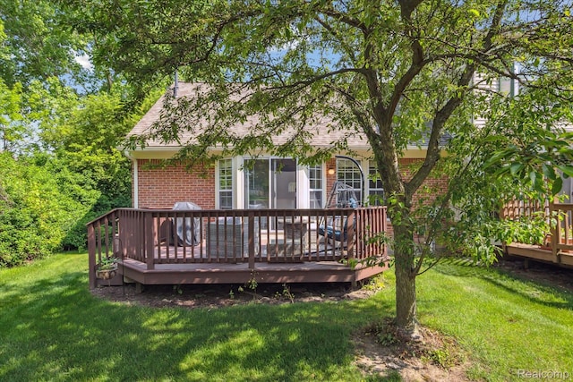 43687 Christopher Ct, Canton, MI 48188 - rear view of house with brick siding, a wooden deck, and a yard