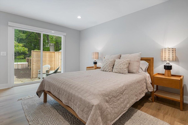 4067 Hillside Trl, New Buffalo, MI 49117 - bedroom with access to outside, wood finished floors, baseboards, and recessed lighting