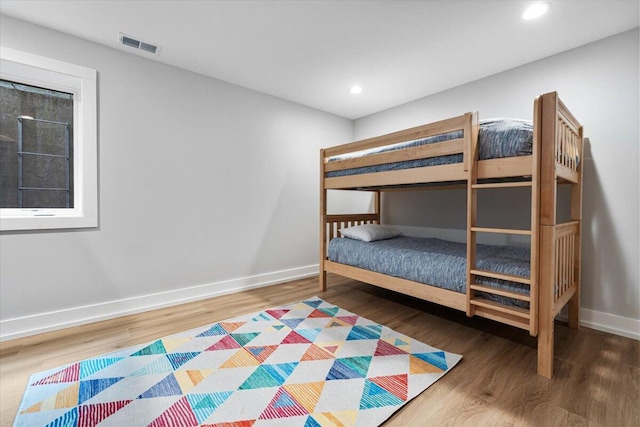 4067 Hillside Trl, New Buffalo, MI 49117 - unfurnished bedroom with wood finished floors, baseboards, and recessed lighting