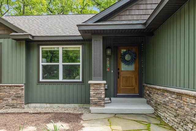 4067 Hillside Trl, New Buffalo, MI 49117 - doorway to property featuring roof with shingles and board and batten siding