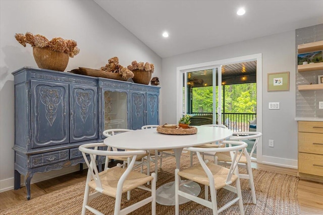 4067 Hillside Trl, New Buffalo, MI 49117 - dining space with light wood-style floors, baseboards, vaulted ceiling, and recessed lighting