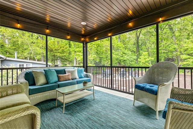 4067 Hillside Trl, New Buffalo, MI 49117 - sunroom / solarium with an outdoor living space and a view of trees