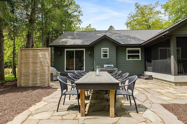 4067 Hillside Trl, New Buffalo, MI 49117 - view of patio / terrace featuring a sunroom and outdoor dining area