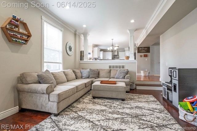 2858 Au Gres River Dr, Fowlerville, MI 48836 - living area with ornate columns, crown molding, dark wood-style flooring, a chandelier, and baseboards